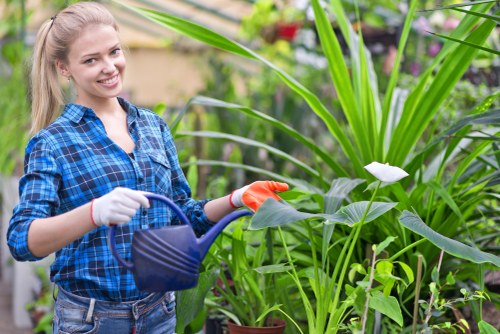 Company banner with gardening tools and a commitment statement