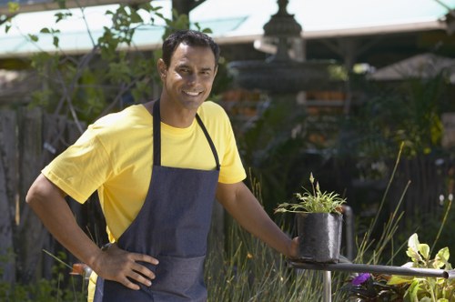 Gardeners sorting green waste at collection point